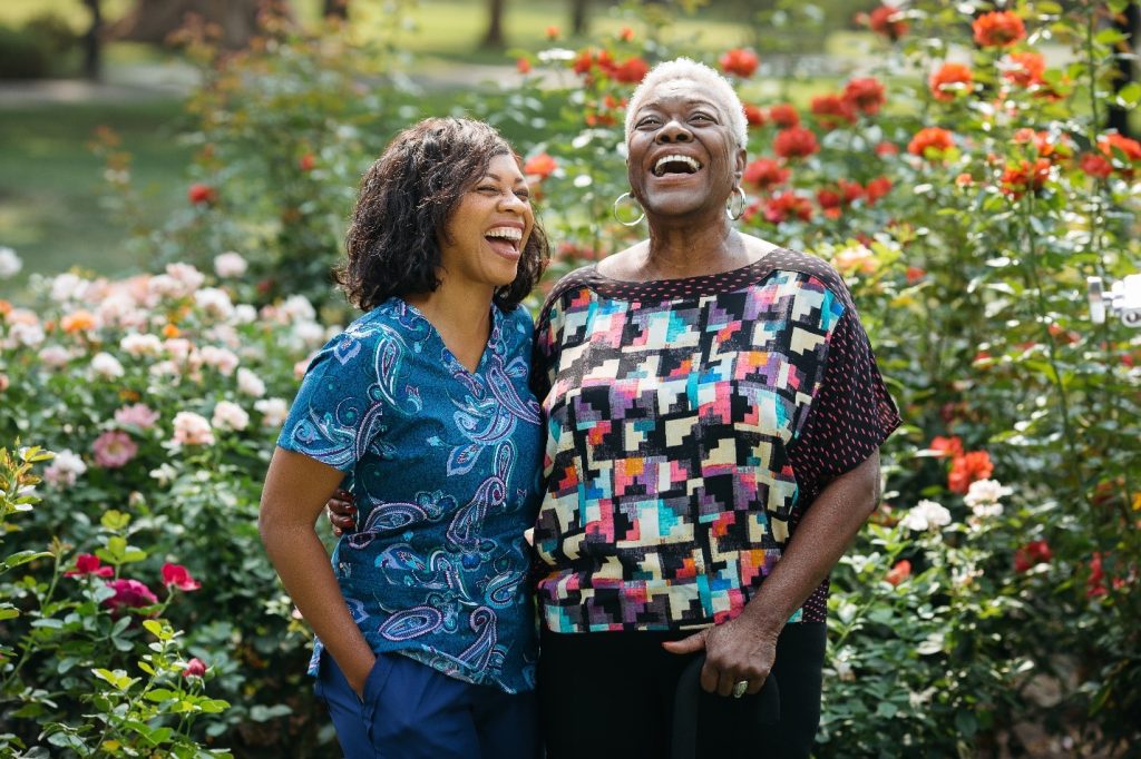 Caregiver meeting with client and laughing